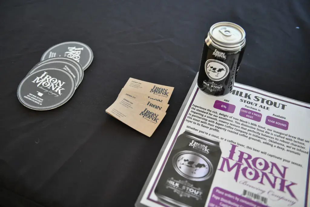 Iron Monk brewery merchandise and promotional materials displayed on a black surface at the festival.