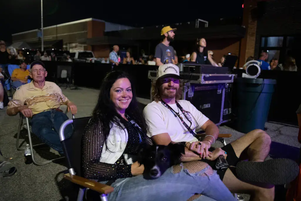 Festival attendees enjoy the evening performance from their seats at the Dancing Rabbit Music Festival.